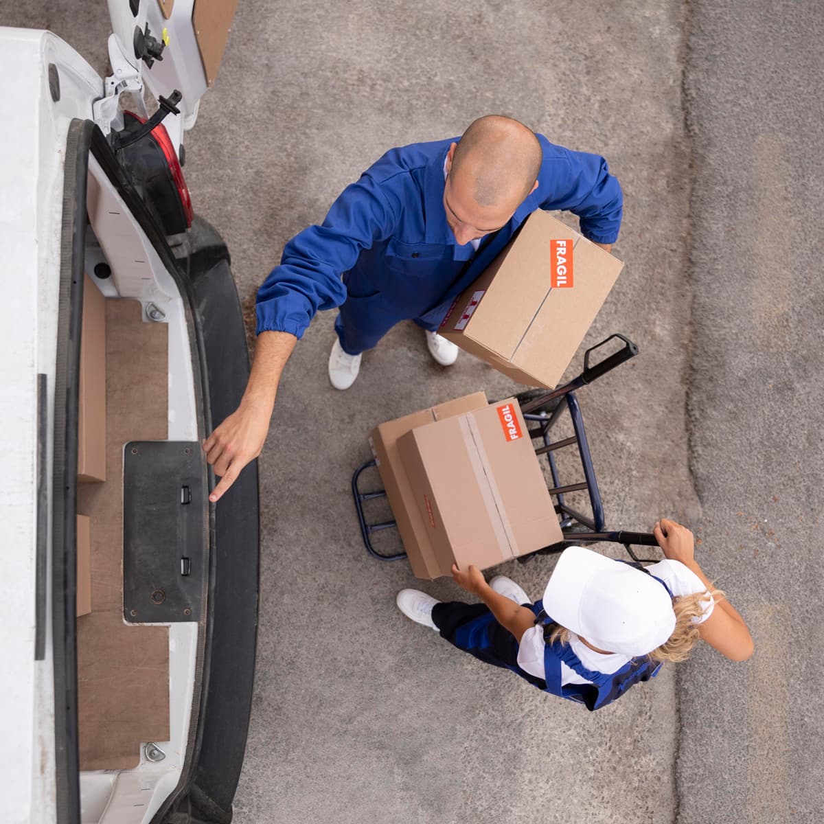 aerial view of two shipping workers